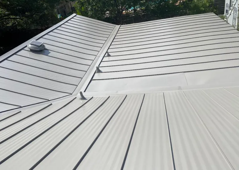 Solar attic fan installed on a metal roof for Roof Ventilation in Discovery Bay